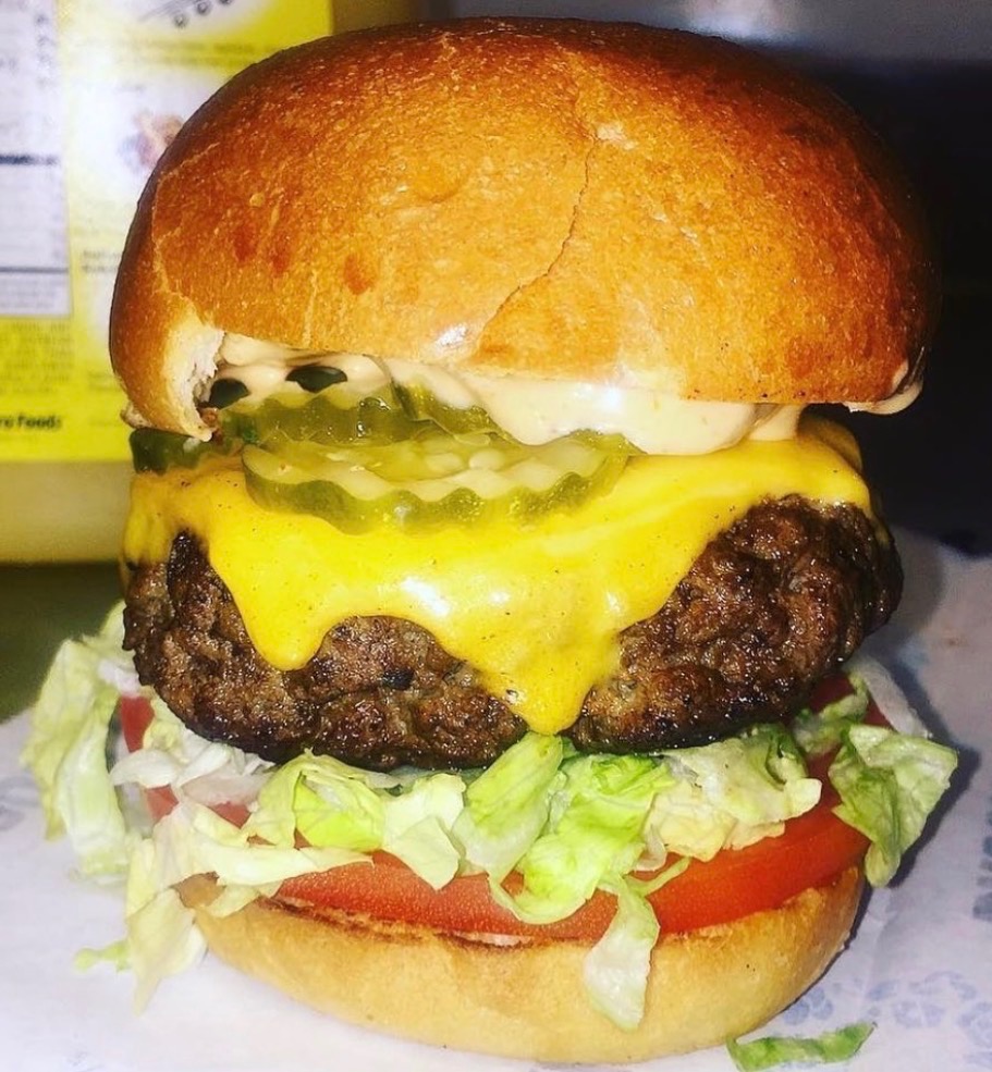 Earline’s Kitchen cheeseburger with melted cheese, lettuce, tomato and pickles